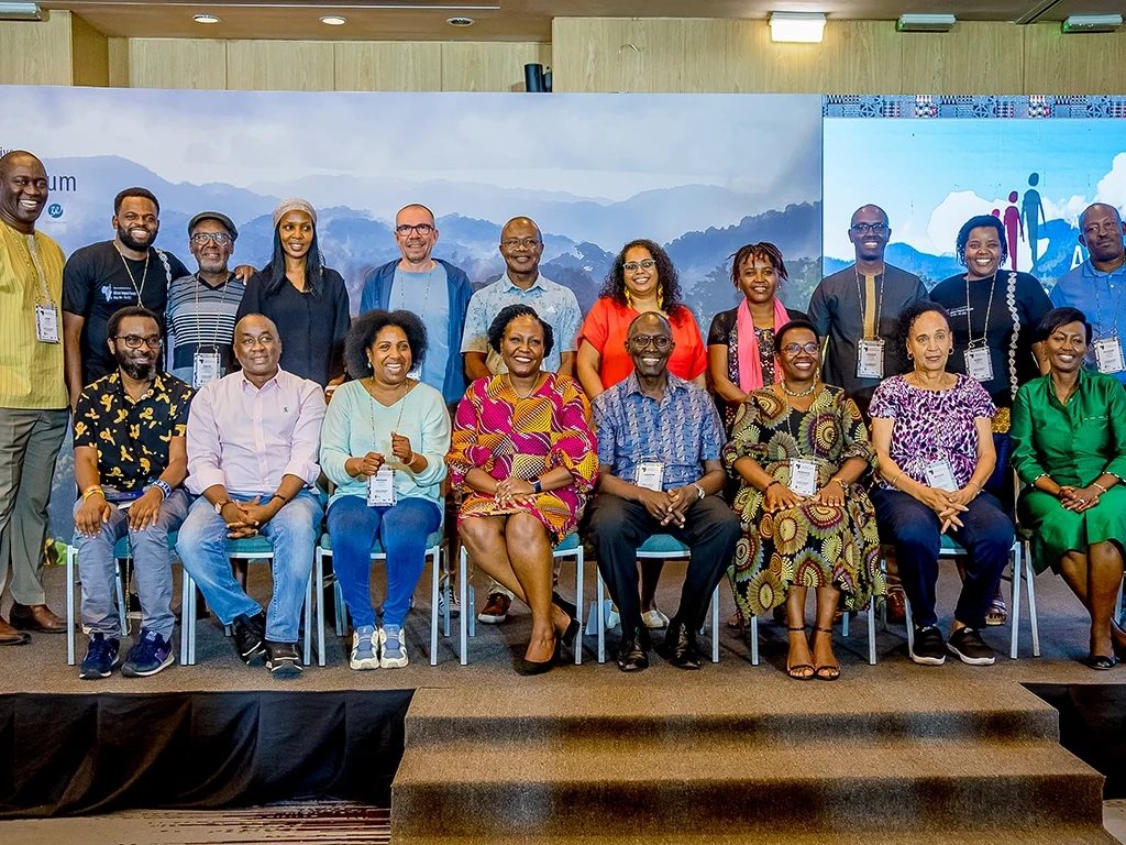 Group photo of ALI-East Africa fellows gathered on stage during a leadership symposium.