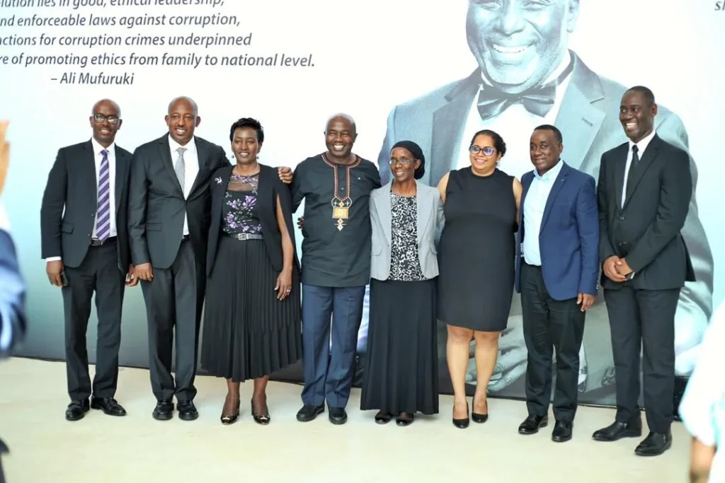 Founders and board members of ALI-East Africa standing together beside a backdrop featuring an Ali Mufuruki quote, symbolising the organisation’s roots in ethical leadership.